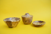 Load image into Gallery viewer, A wooden bowl, a wooden vase and a wooden dish on a yellow background.