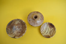 Load image into Gallery viewer, A birds eye view of a wooden bowl, a wooden dish and a wooden vase on a yellow background.