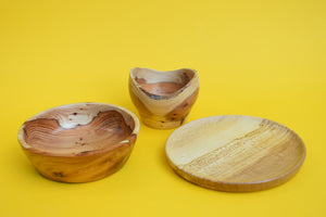Wooden Plate and Bowl Set on a yellow background. 